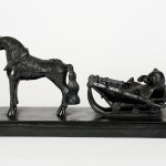 CAST IRON MODEL OF A BEAR IN A TROIKA