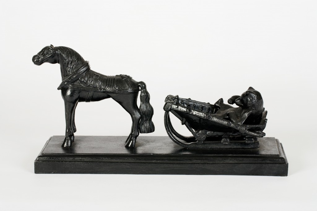 CAST IRON MODEL OF A BEAR IN A TROIKA