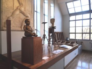 Seated Baby, 1937-8, bronze ion display in the Modelling studio, Dorich house
