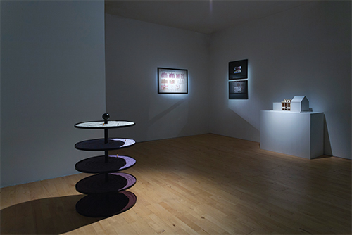 Dora Exhibition View, Stanley Picker Gallery, Kingston University Foreground: Nicole Wermers Untitled Ash Tray (2010) Powder-Coated Steel, Sand, Pigment & Cigarette Butts / Courtesy the Artist and Herald Street